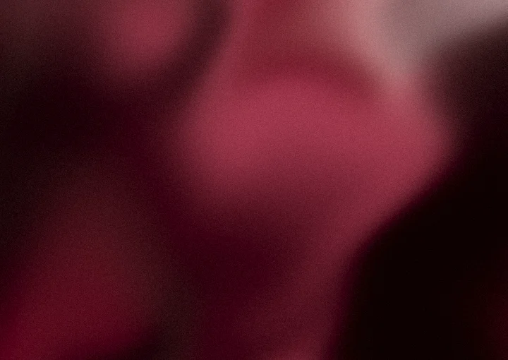 Maroon grainy gradient background 1 with hex #701426, #a63a50